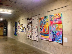 Banners created by groups of children and youth during the summer months expressing theirs thoughts and feelings on the theme of "Breaking Barriers". 